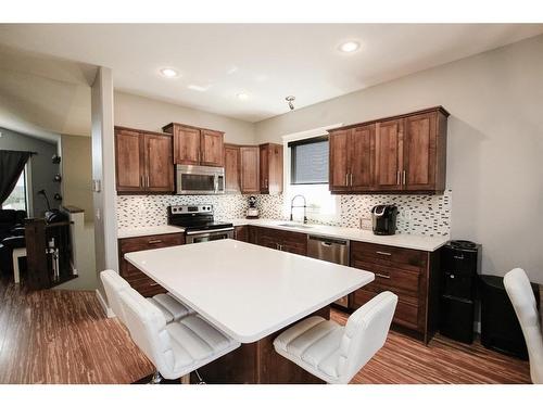 32 Iron Wolf Boulevard, Lacombe, AB - Indoor Photo Showing Kitchen With Upgraded Kitchen