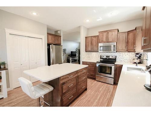 32 Iron Wolf Boulevard, Lacombe, AB - Indoor Photo Showing Kitchen With Upgraded Kitchen