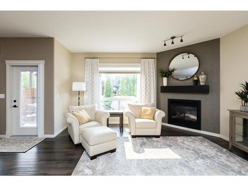 19 Voisin Close, Red Deer, AB - Indoor Photo Showing Living Room With Fireplace