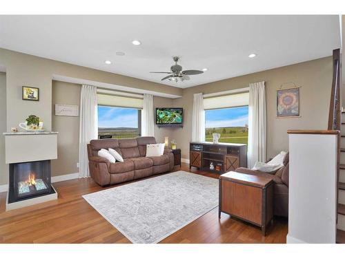 10-421032 284 Range Road, Rural Ponoka County, AB - Indoor Photo Showing Living Room With Fireplace