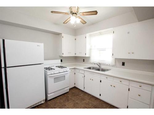 4624 49 Street, Red Deer, AB - Indoor Photo Showing Kitchen With Double Sink