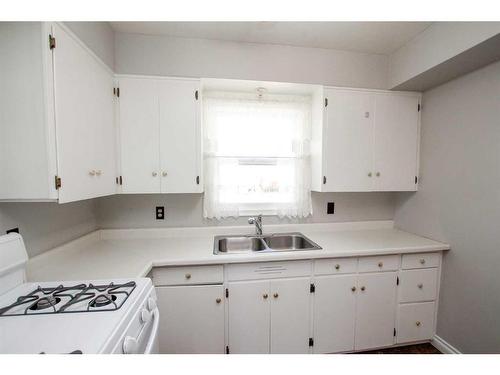 4624 49 Street, Red Deer, AB - Indoor Photo Showing Kitchen With Double Sink