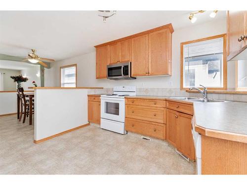 22 Lanterman Close, Red Deer, AB - Indoor Photo Showing Kitchen With Double Sink
