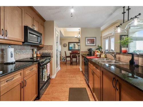 601-9020 Jasper Avenue Nw, Edmonton, AB - Indoor Photo Showing Kitchen With Double Sink