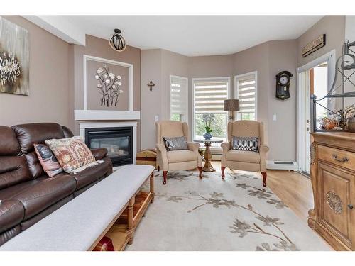 205-4512 52 Avenue, Red Deer, AB - Indoor Photo Showing Living Room With Fireplace
