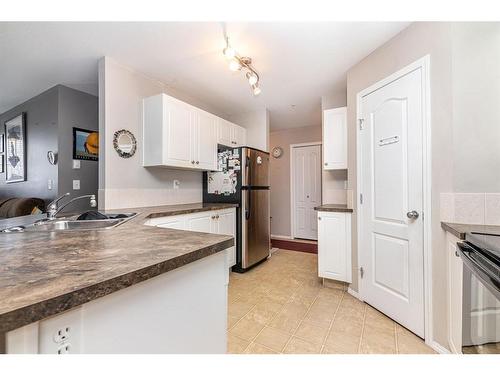 106-3730 50 Avenue, Red Deer, AB - Indoor Photo Showing Kitchen With Double Sink