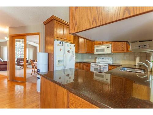 4102 66 Street, Stettler, AB - Indoor Photo Showing Kitchen With Double Sink