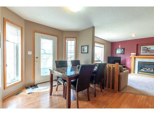 4102 66 Street, Stettler, AB - Indoor Photo Showing Dining Room With Fireplace