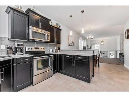 70 Harvest Close, Penhold, AB - Indoor Photo Showing Kitchen With Stainless Steel Kitchen