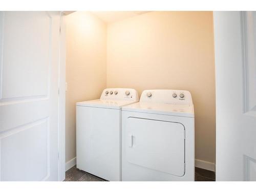 50 Mackenzie Avenue, Lacombe, AB - Indoor Photo Showing Laundry Room