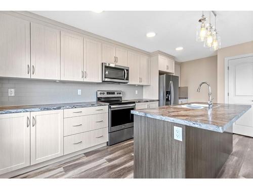 50 Mackenzie Avenue, Lacombe, AB - Indoor Photo Showing Kitchen With Upgraded Kitchen