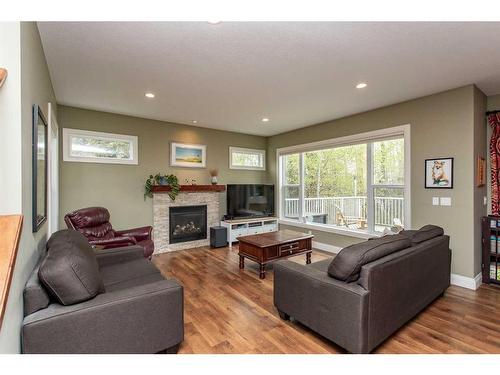 216 28302 Highway 12A, Gull Lake, AB - Indoor Photo Showing Living Room With Fireplace