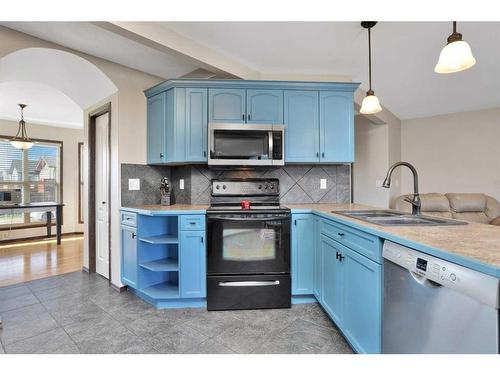 27 Lodge Place, Sylvan Lake, AB - Indoor Photo Showing Kitchen With Double Sink