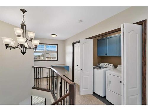 27 Lodge Place, Sylvan Lake, AB - Indoor Photo Showing Laundry Room