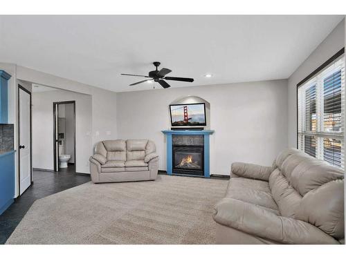 27 Lodge Place, Sylvan Lake, AB - Indoor Photo Showing Living Room With Fireplace