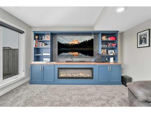 8 Victor Close, Sylvan Lake, AB - Indoor Photo Showing Other Room With Fireplace
