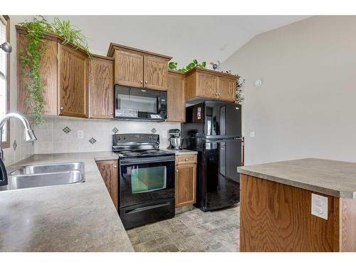 127 Landry Bend, Red Deer, AB - Indoor Photo Showing Kitchen With Double Sink