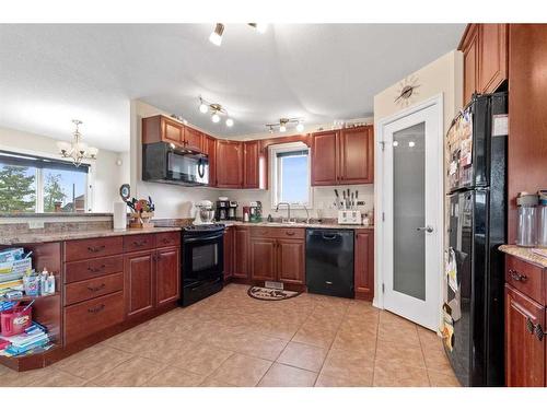 4021-25054 South Pine Lake Road, Rural Red Deer County, AB - Indoor Photo Showing Kitchen With Double Sink