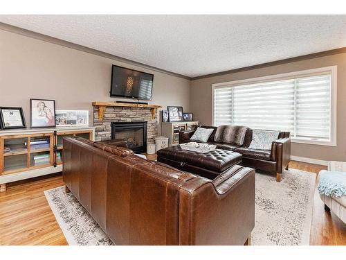 4717 43 Avenue, Red Deer, AB - Indoor Photo Showing Living Room With Fireplace