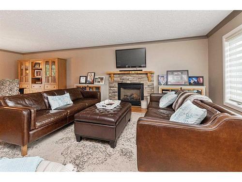 4717 43 Avenue, Red Deer, AB - Indoor Photo Showing Living Room With Fireplace