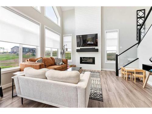 1-421008 Range Road 14, Rural Ponoka County, AB - Indoor Photo Showing Living Room With Fireplace