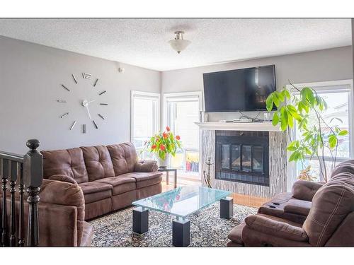 16 Whiteram Mews Ne, Calgary, AB - Indoor Photo Showing Living Room With Fireplace