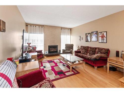 5135 38 Street Close, Innisfail, AB - Indoor Photo Showing Living Room With Fireplace