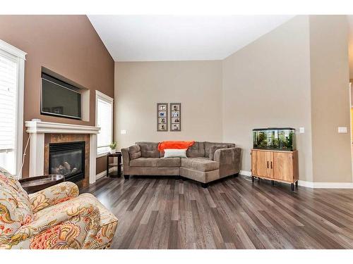 149 Sutherland Close, Red Deer, AB - Indoor Photo Showing Living Room With Fireplace