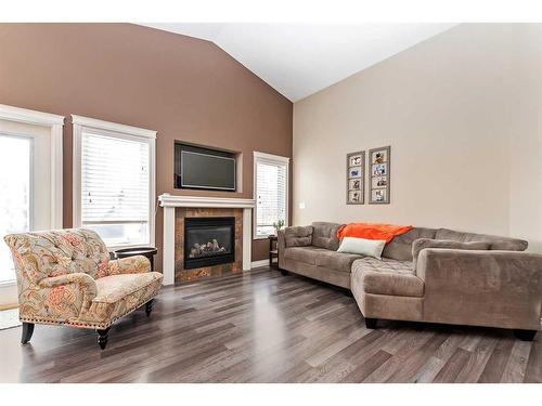 149 Sutherland Close, Red Deer, AB - Indoor Photo Showing Living Room With Fireplace