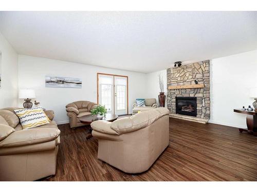 44-27264 Township Road 392, Rural Red Deer County, AB - Indoor Photo Showing Living Room With Fireplace