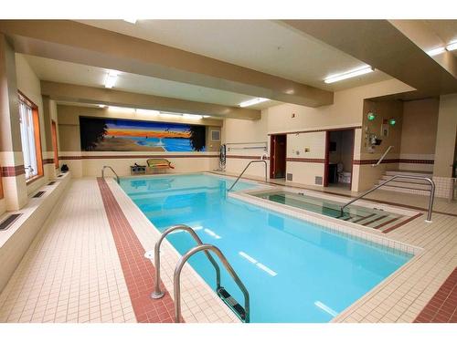 211-5300 48 Street, Red Deer, AB - Indoor Photo Showing Other Room With In Ground Pool