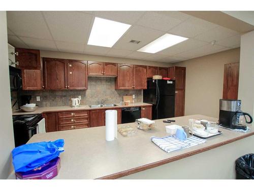 211-5300 48 Street, Red Deer, AB - Indoor Photo Showing Kitchen With Double Sink