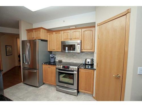 211-5300 48 Street, Red Deer, AB - Indoor Photo Showing Kitchen With Stainless Steel Kitchen