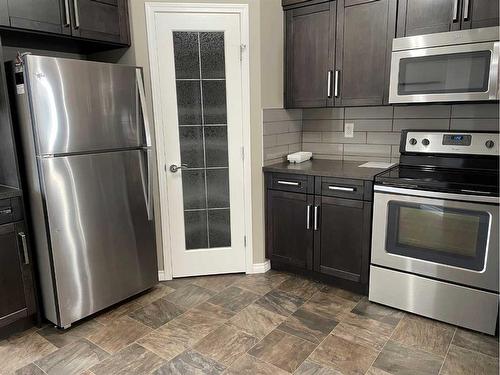 3 Concord Rise, Sylvan Lake, AB - Indoor Photo Showing Kitchen With Stainless Steel Kitchen