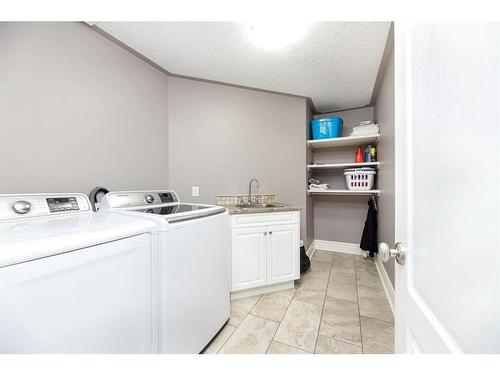 21 Rosedale Avenue, Rural Lacombe County, AB - Indoor Photo Showing Laundry Room