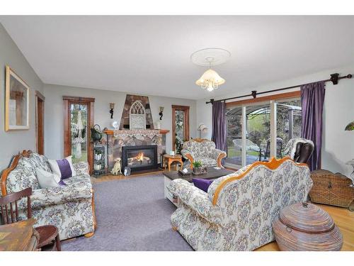 25237 595 Highway, Rural Red Deer County, AB - Indoor Photo Showing Living Room With Fireplace