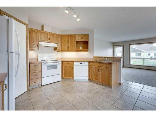103 Jenkins Drive, Red Deer, AB - Indoor Photo Showing Kitchen With Double Sink