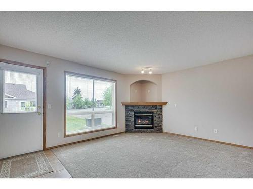 103 Jenkins Drive, Red Deer, AB - Indoor Photo Showing Living Room With Fireplace