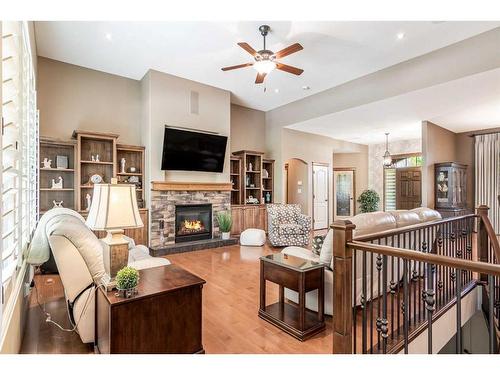 301 Jarvis Glen Court, Jarvis Bay, AB - Indoor Photo Showing Living Room With Fireplace