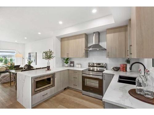 885-903 Mahogany Boulevard Se, Calgary, AB - Indoor Photo Showing Kitchen With Double Sink With Upgraded Kitchen