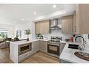 885-903 Mahogany Boulevard Se, Calgary, AB  - Indoor Photo Showing Kitchen With Double Sink With Upgraded Kitchen 