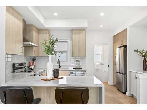 885-903 Mahogany Boulevard Se, Calgary, AB - Indoor Photo Showing Kitchen With Upgraded Kitchen