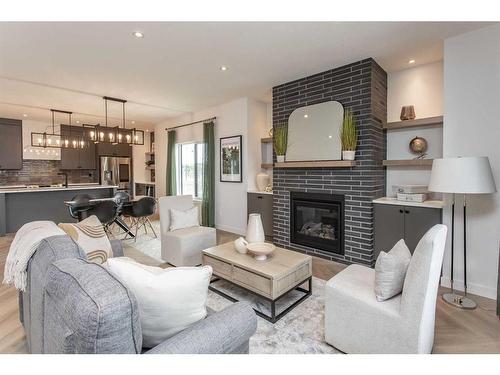 49 Tranter Street, Red Deer, AB - Indoor Photo Showing Living Room With Fireplace