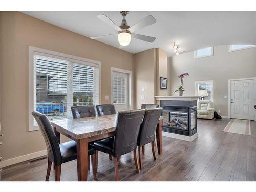 2 Garrison Place, Red Deer, AB - Indoor Photo Showing Dining Room With Fireplace