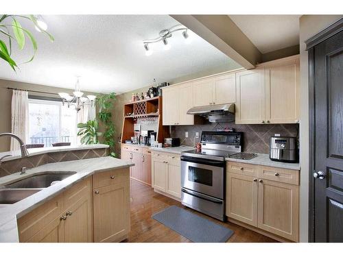 1068 Sherwood Boulevard Nw, Calgary, AB - Indoor Photo Showing Kitchen With Double Sink