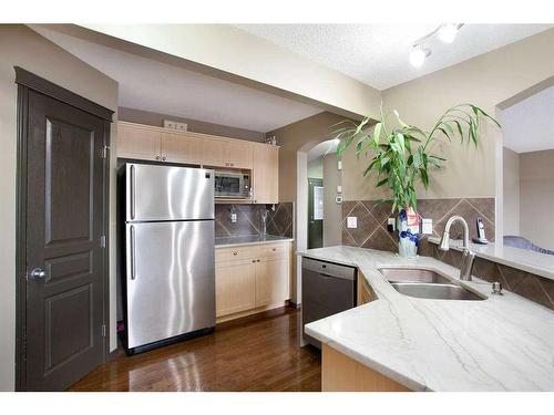 1068 Sherwood Boulevard Nw, Calgary, AB - Indoor Photo Showing Kitchen With Double Sink