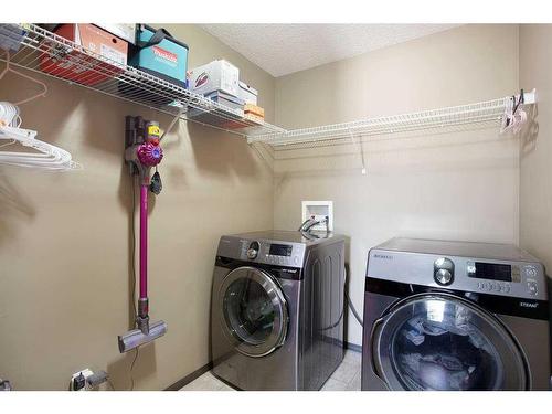 1068 Sherwood Boulevard Nw, Calgary, AB - Indoor Photo Showing Laundry Room