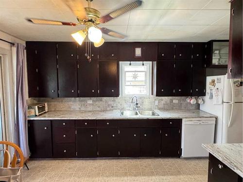 3912 46 Street, Ponoka, AB - Indoor Photo Showing Kitchen With Double Sink