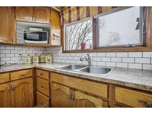 4307 57 Avenue, Innisfail, AB - Indoor Photo Showing Kitchen With Double Sink