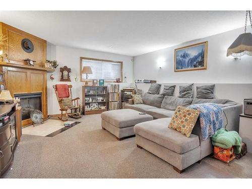4307 57 Avenue, Innisfail, AB - Indoor Photo Showing Living Room With Fireplace